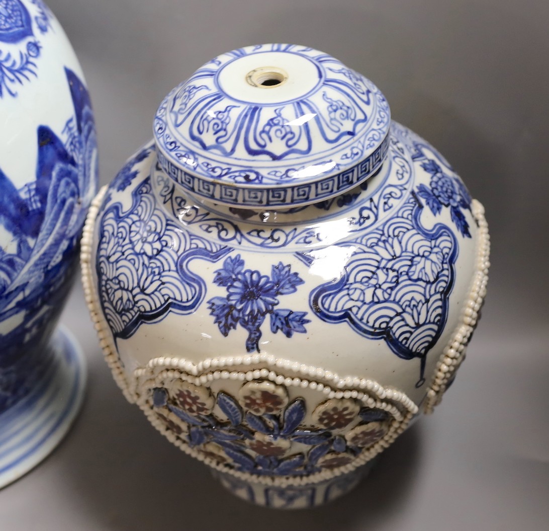 A large Chinese blue and white jar and cover and a blue and white jar and cover, 19th-century and later. Largest 44cm